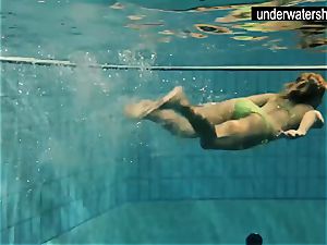 two fabulous amateurs showcasing their bodies off under water